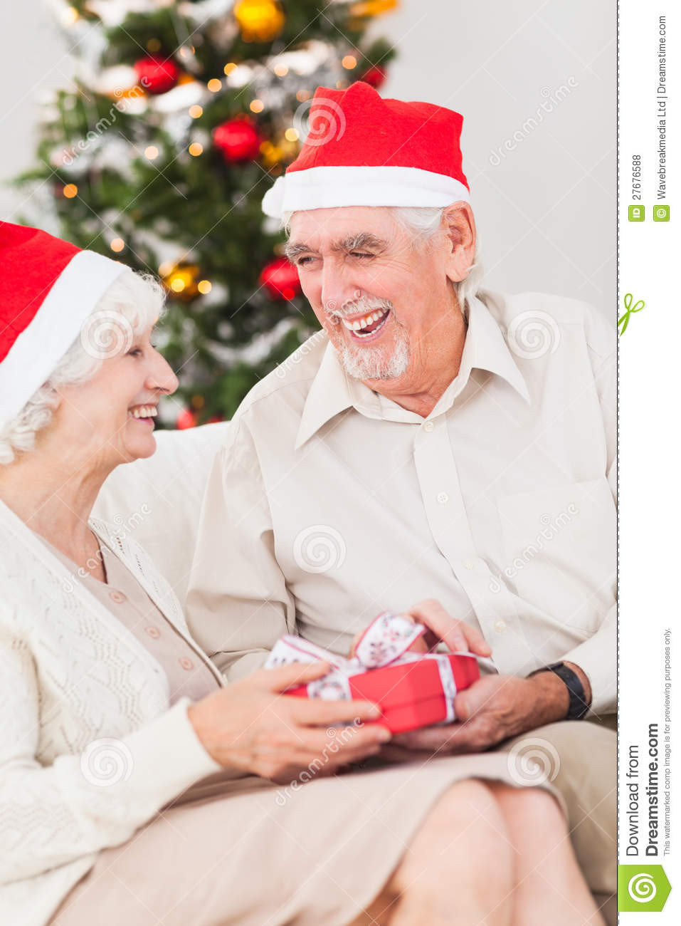 Christmas Gift Ideas For Older Couple
 Elderly Couple Exchanging Christmas Gifts Stock