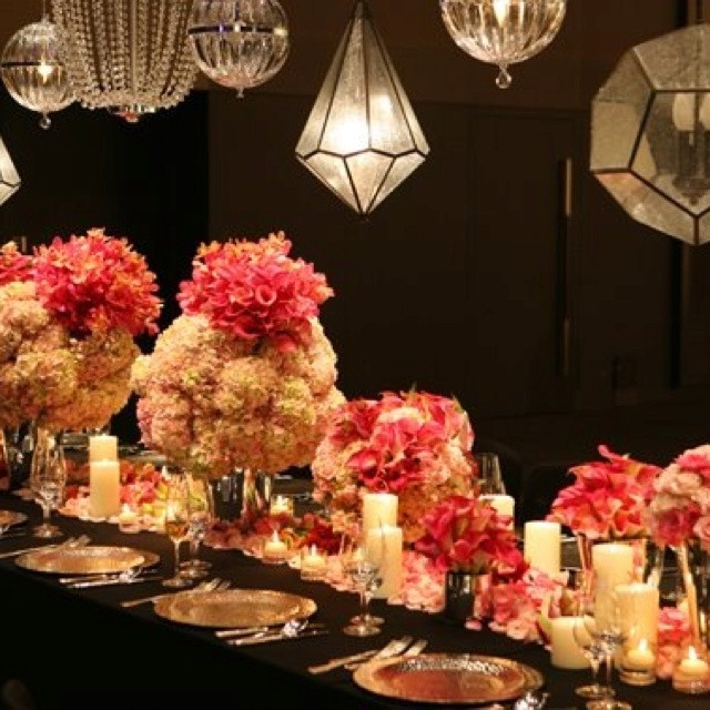 Elegant Dinner Party Decorating Ideas
 The contrast of the vibrant flowers and metal chandeliers