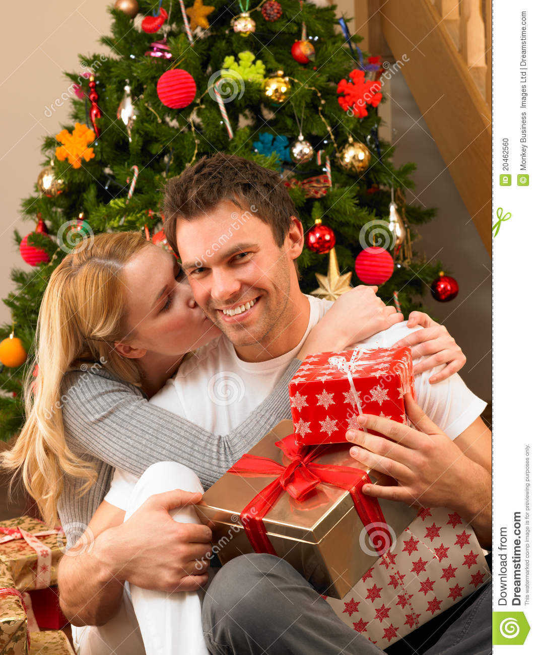 Gift Ideas For Young Couple
 Young Couple With Gifts In Front Christmas Tree Stock