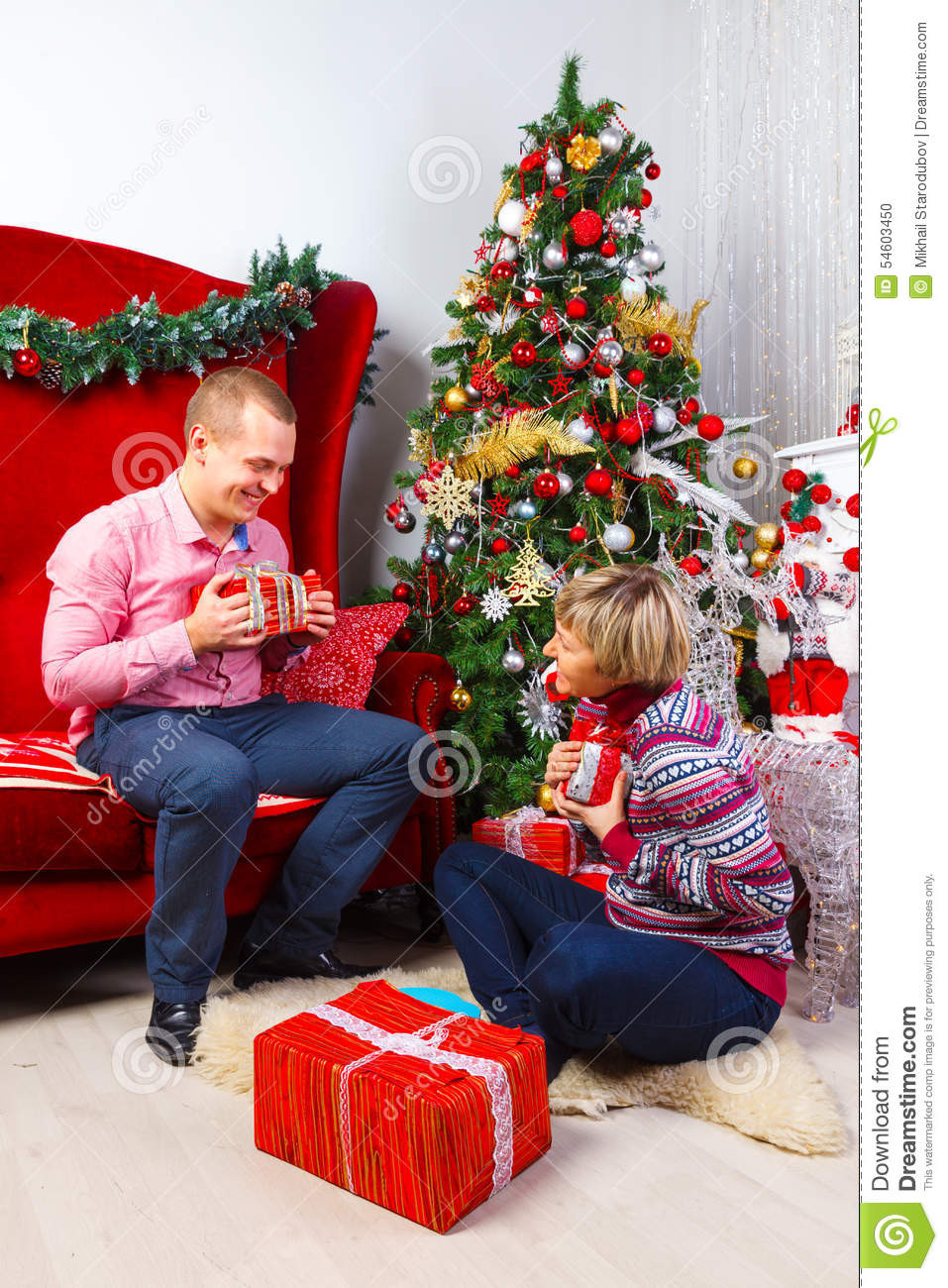 Gift Ideas For Young Couples
 Happy Young Couple With Gifts At New Year Stock