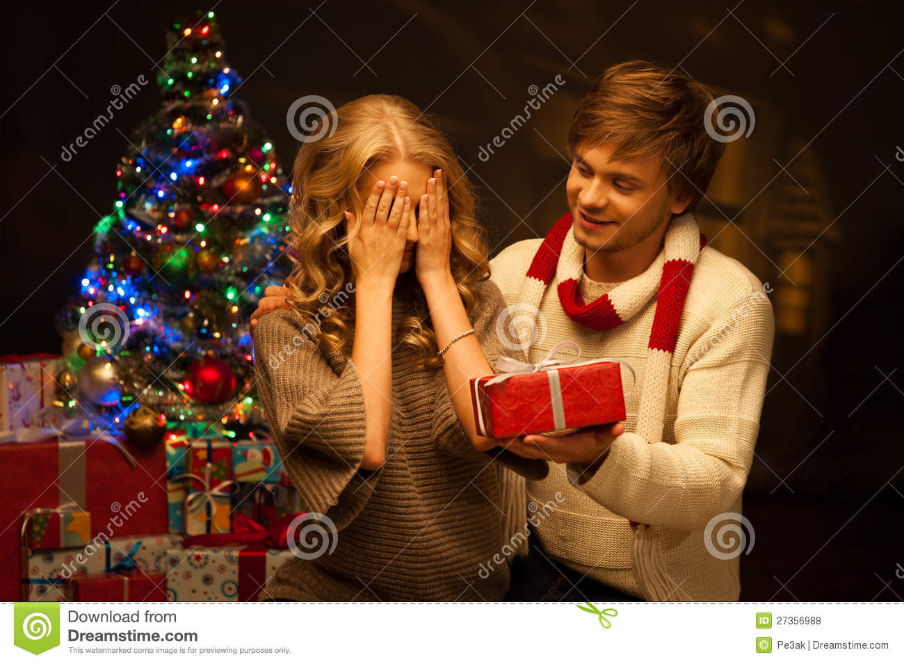 Gift Ideas For Young Couples
 Young Couple Presenting Christmas Gift Royalty Free Stock
