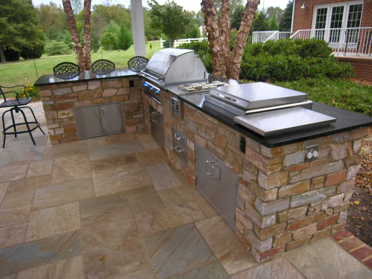 Outdoor Kitchen And Bar
 With David Berryhill’s new custom outdoor kitchens
