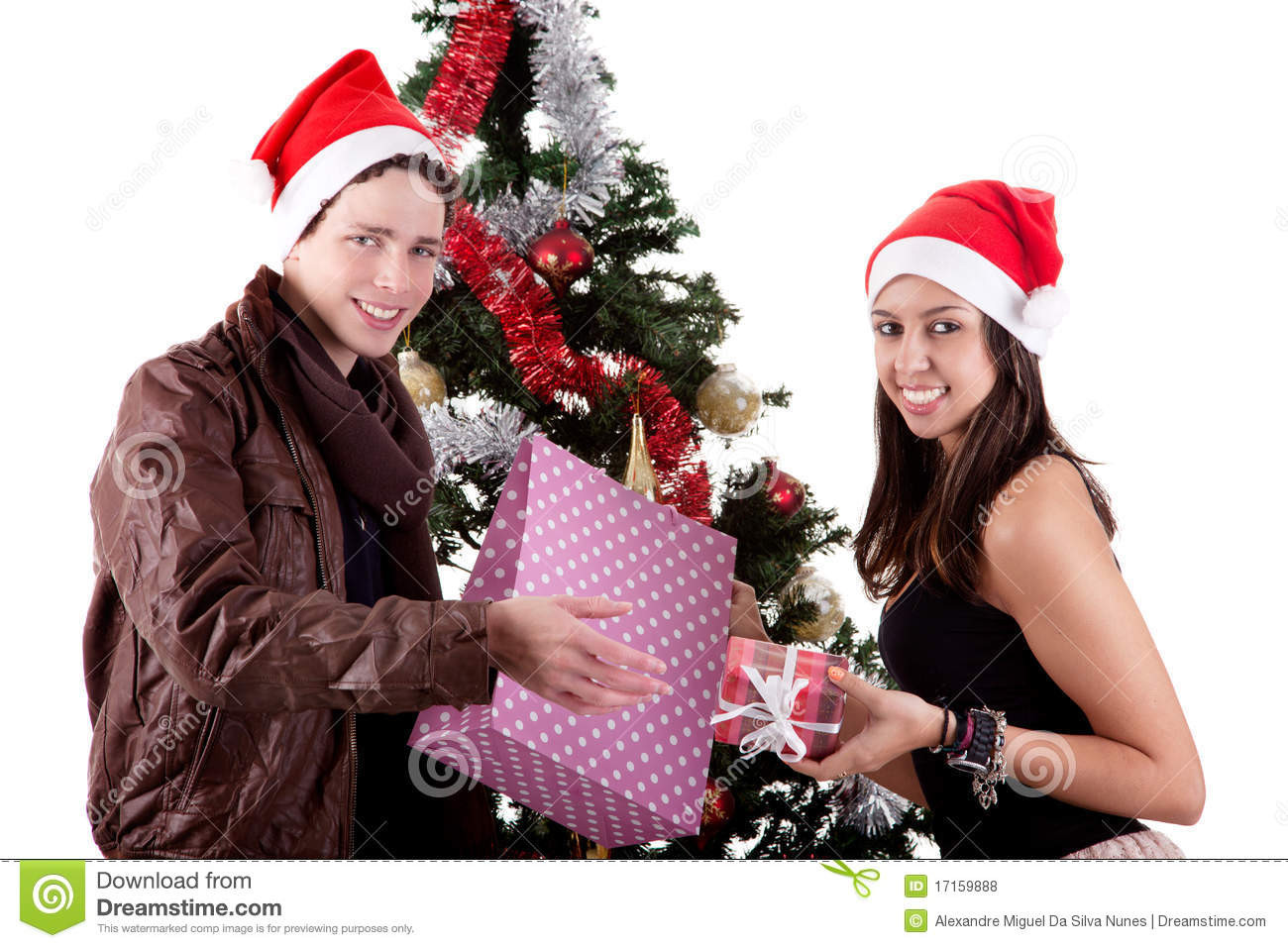 Christmas Gift Ideas For Young Couples
 Young Couple Opening Gifts Beside Christmas Tree Royalty