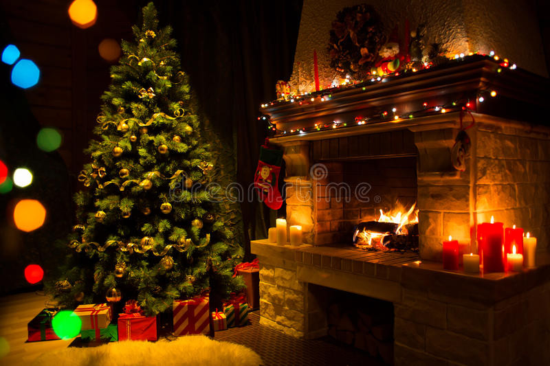 Christmas Living Room Background
 Fireplace And Decorated Christmas Tree And Candles Stock