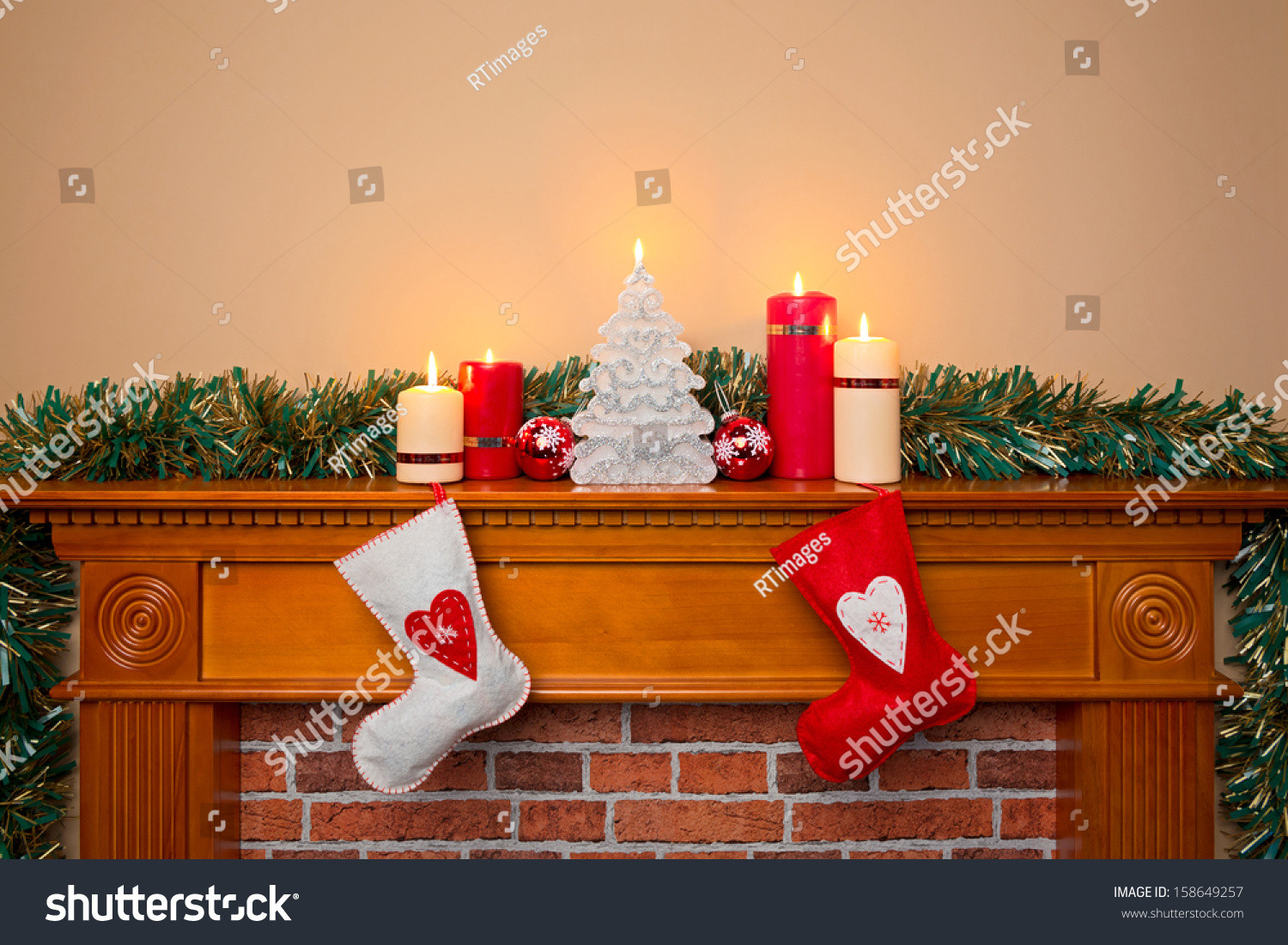 Christmas Stockings Hanging Over Fireplace
 Christmas Stockings Hanging Over A Fireplace With Candles