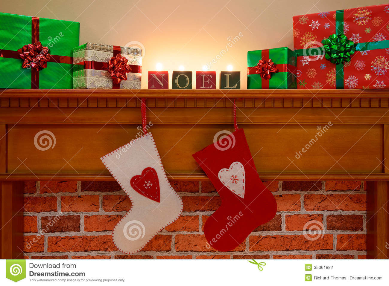 Christmas Stockings Hanging Over Fireplace
 Christmas Stockings Under The Mantlepiece Stock