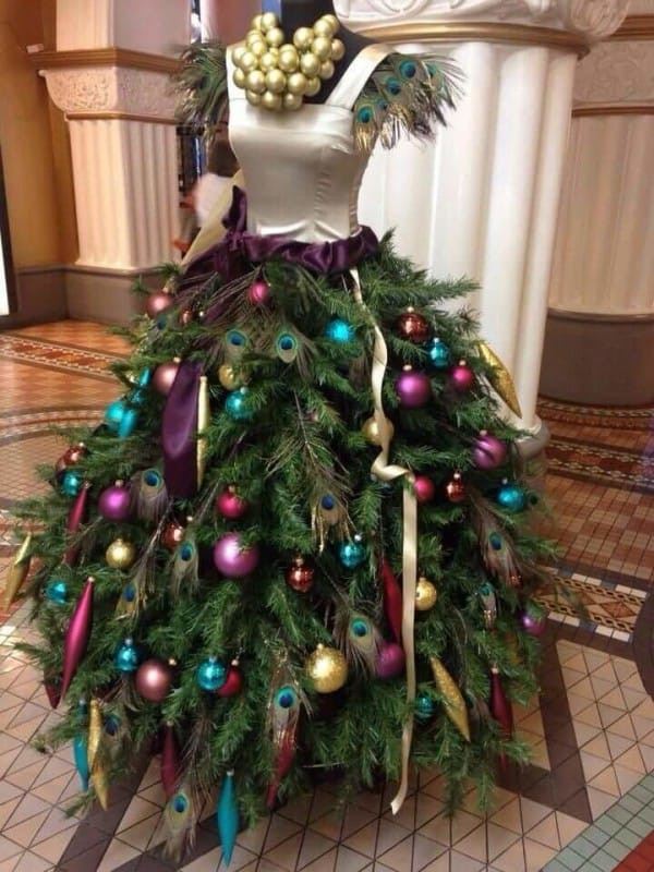 Christmas Tree Dress DIY
 She Attaches Tree Branches To The Old Dress Form What It