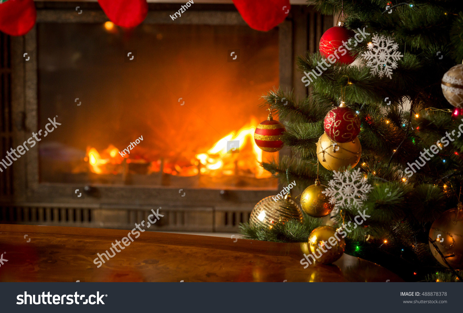 Christmas Tree Next To Fireplace
 Beautiful Decorated Christmas Tree Next To Burning