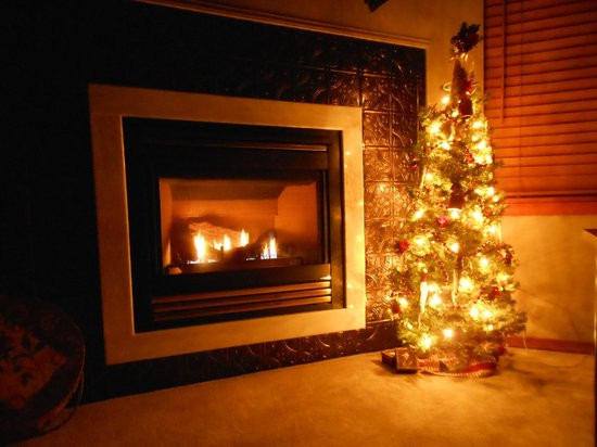 Christmas Tree Next To Fireplace
 The little Christmas tree next to the fireplace in the