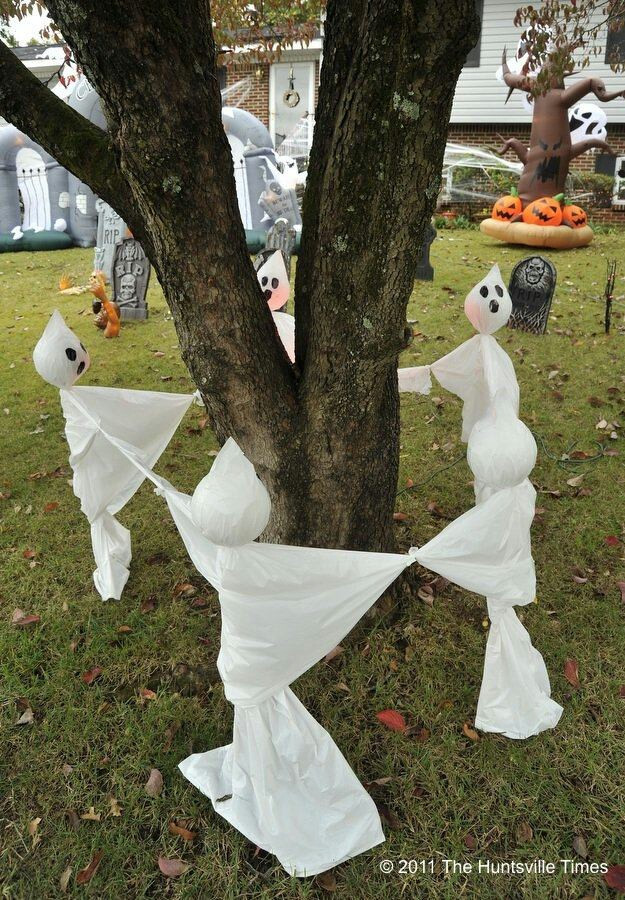 Diy Halloween Outdoor Decorations
 White Ghosts Surrounding Tree To Create Spooky Halloween