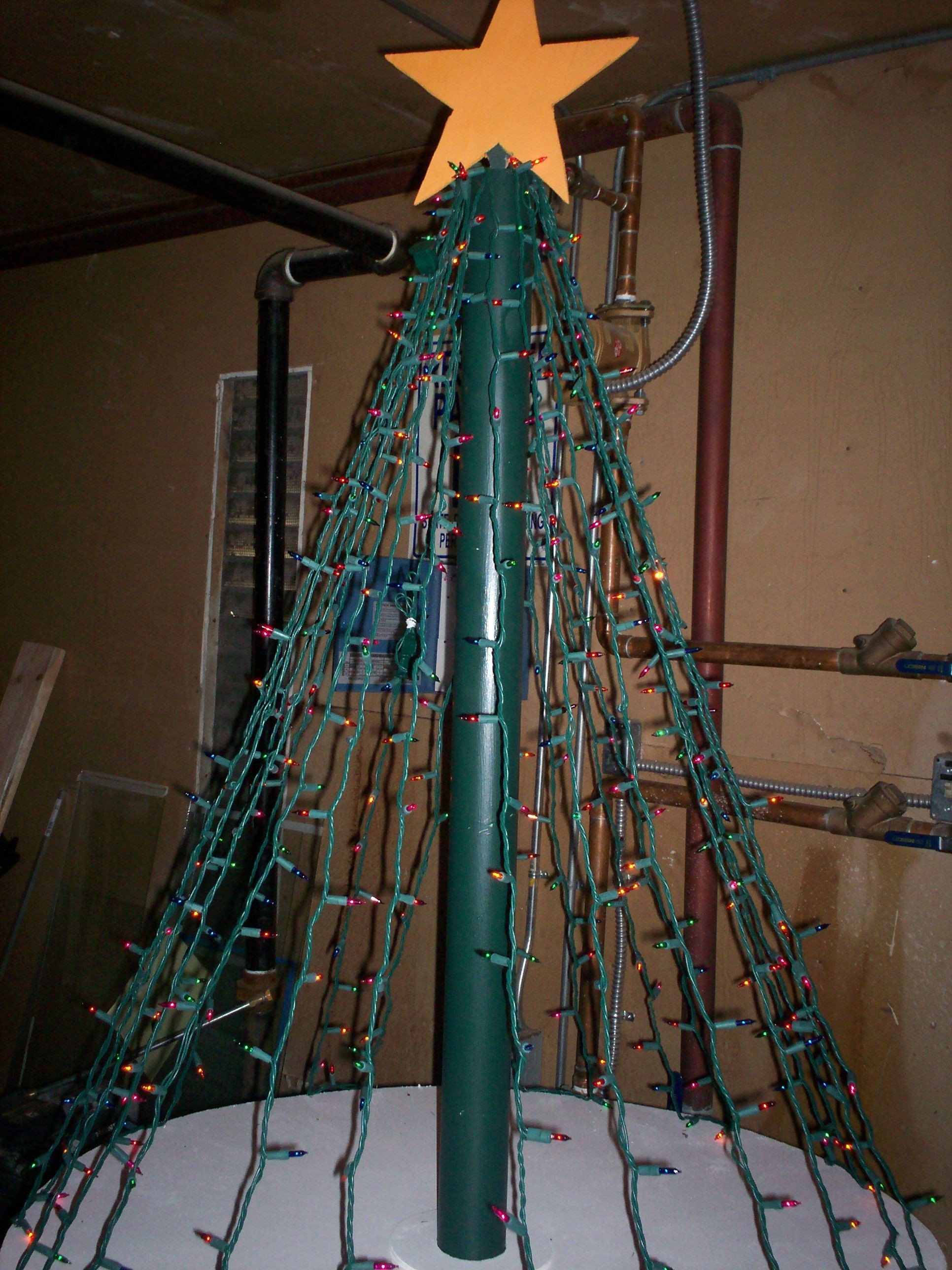 DIY Outdoor Christmas Trees
 Christmas tree made out of plywood lights pvc pipe
