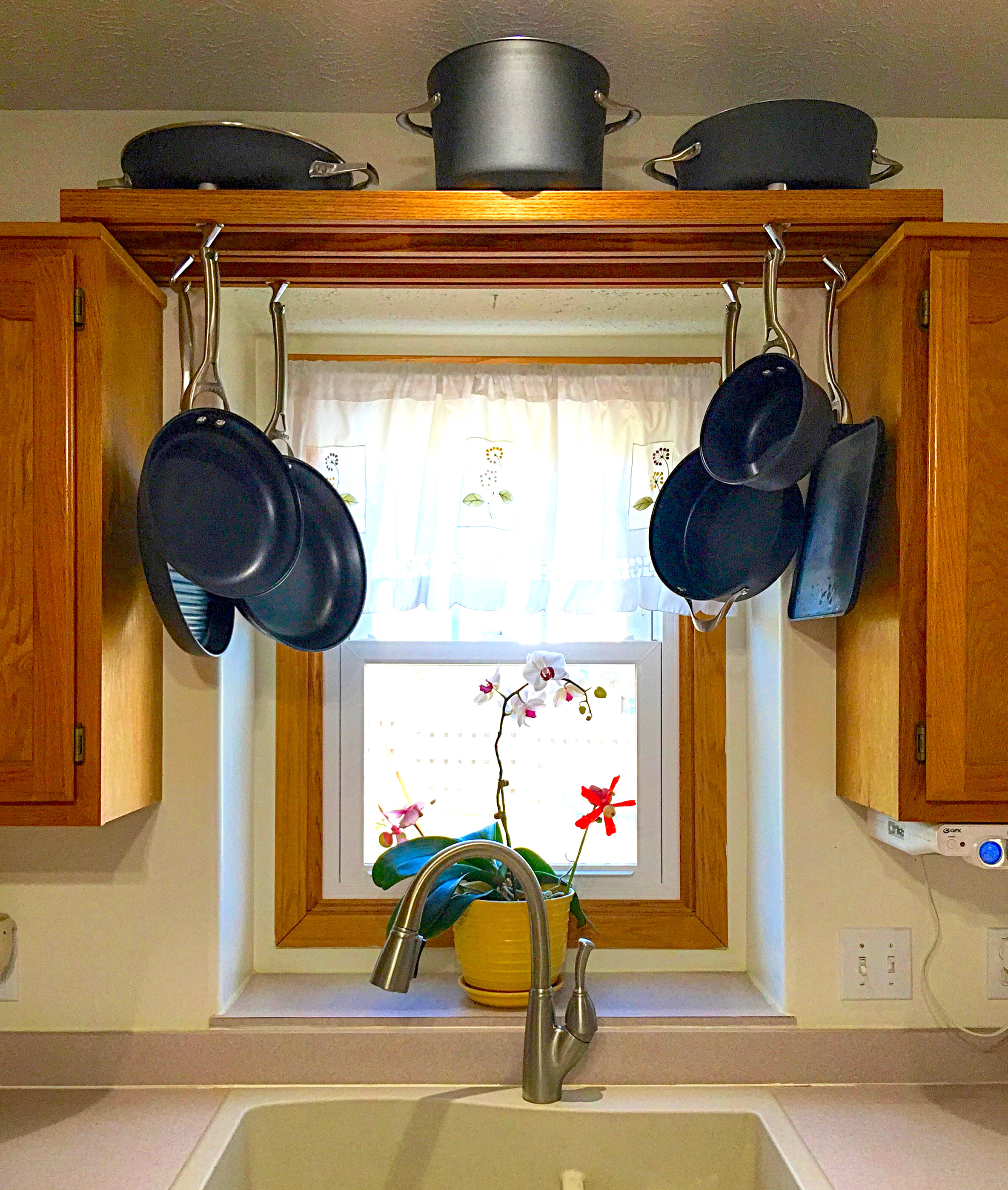 DIY Pot And Pan Rack
 Make use of space over the kitchen sink with this DIY pot