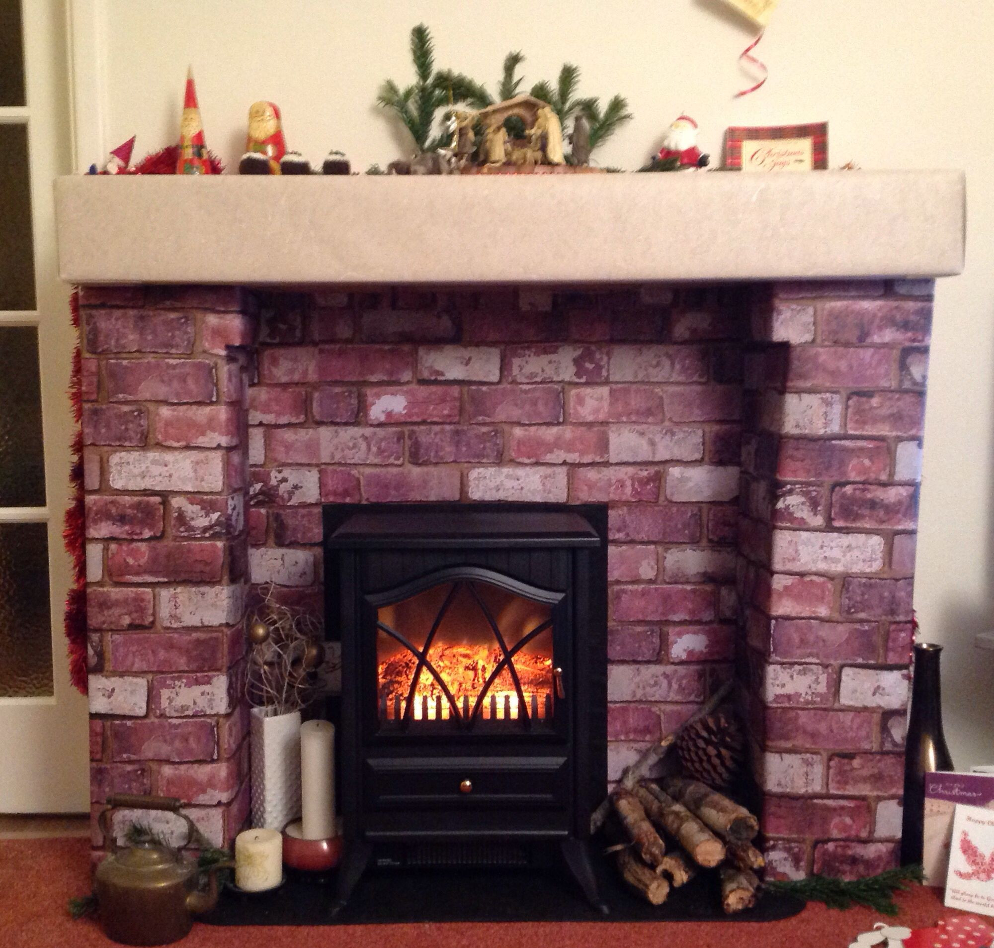 Fake Fireplace For Christmas
 Fake fireplace for Christmas made from cardboard boxes and