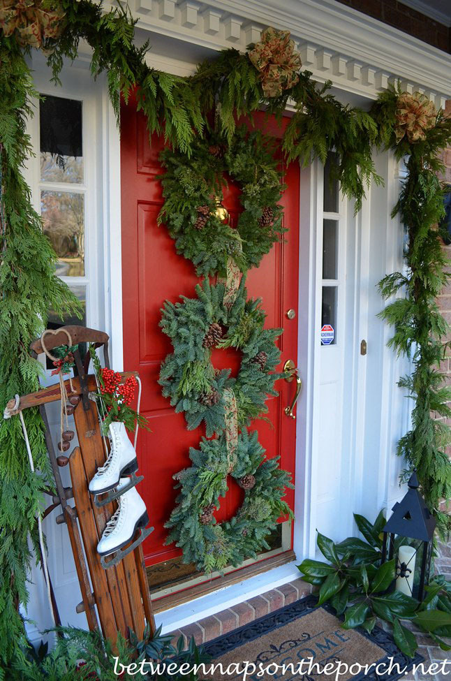 Front Porch Garland Christmas
 Front Porch Decorated for Christmas with Three Wreaths on