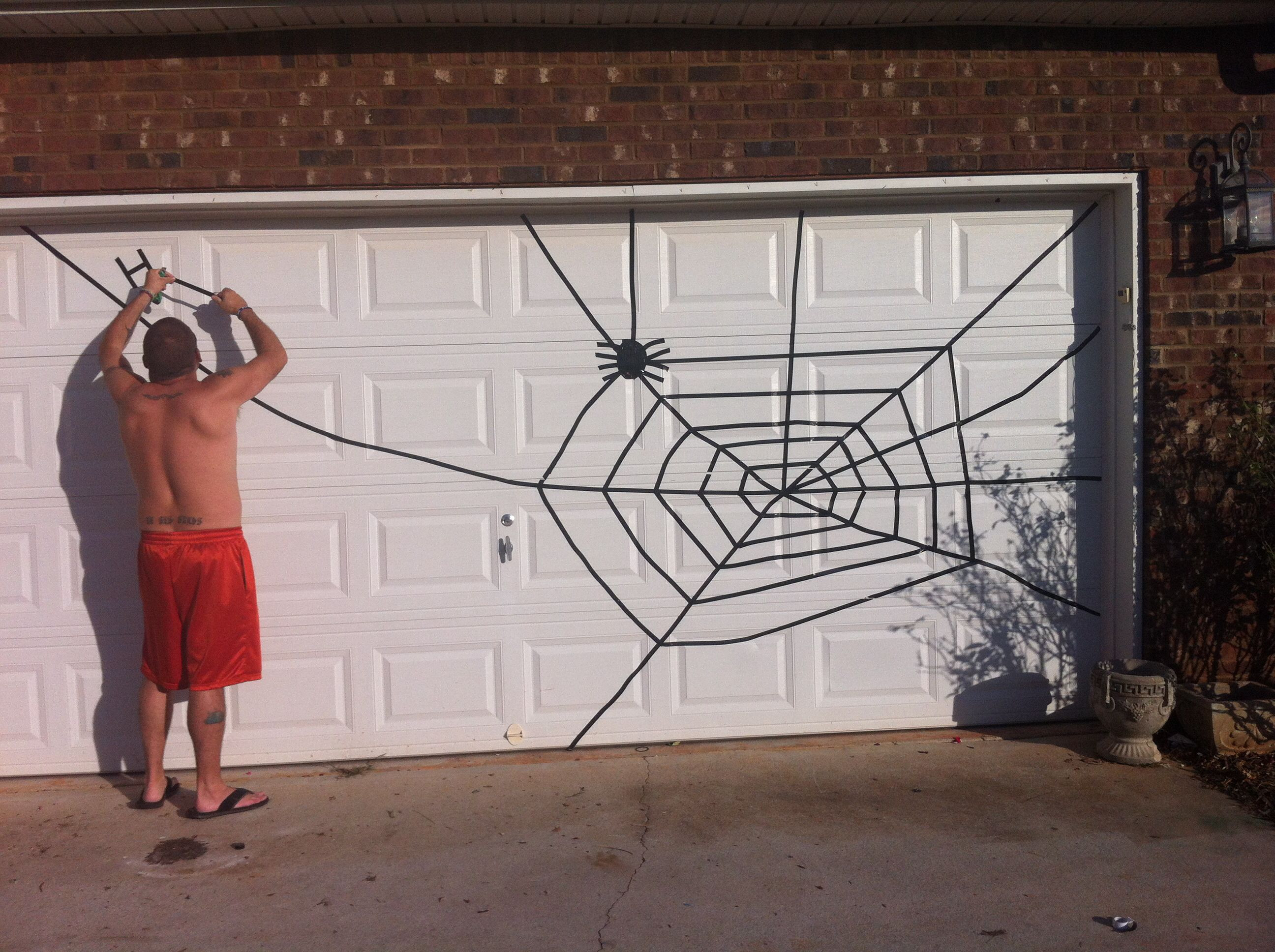 Garage Door Halloween Decoration
 Spider web for Halloween Garage Door Use electrical tape