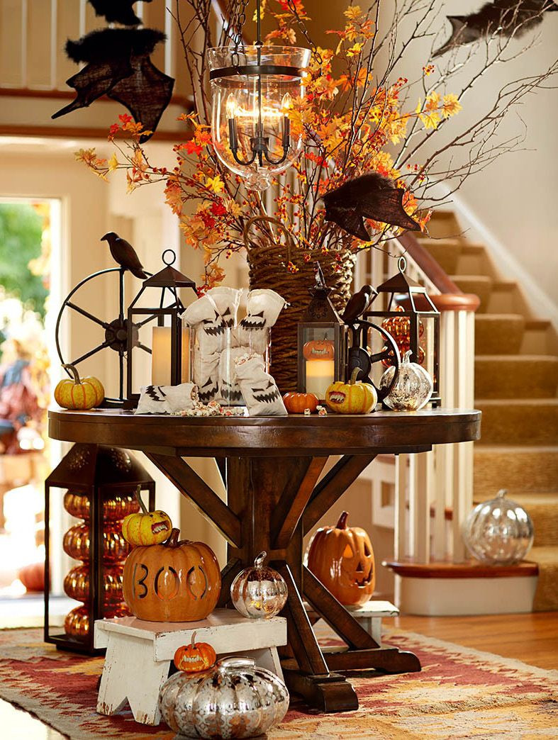 Halloween Table Ware
 Decorate the entryway with pumpkins ghouls and goblins