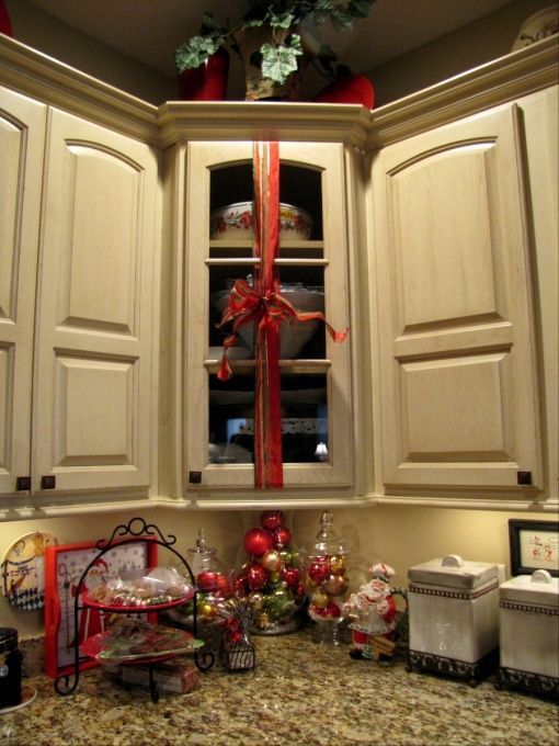 Kitchen Cabinet Christmas Decorating Ideas
 Wrap ribbon with a bow around kitchen cabinets What a