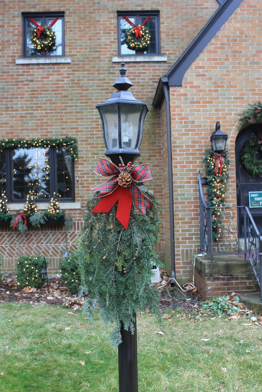 Outdoor Christmas Lamp Post Decoration
 Holiday lamp post just a few evergreen sprigs and ribbon