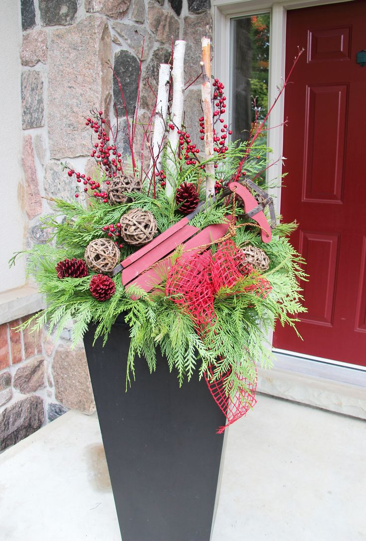 Outdoor Entryway Christmas Trees
 Best 25 Outdoor christmas planters ideas on Pinterest