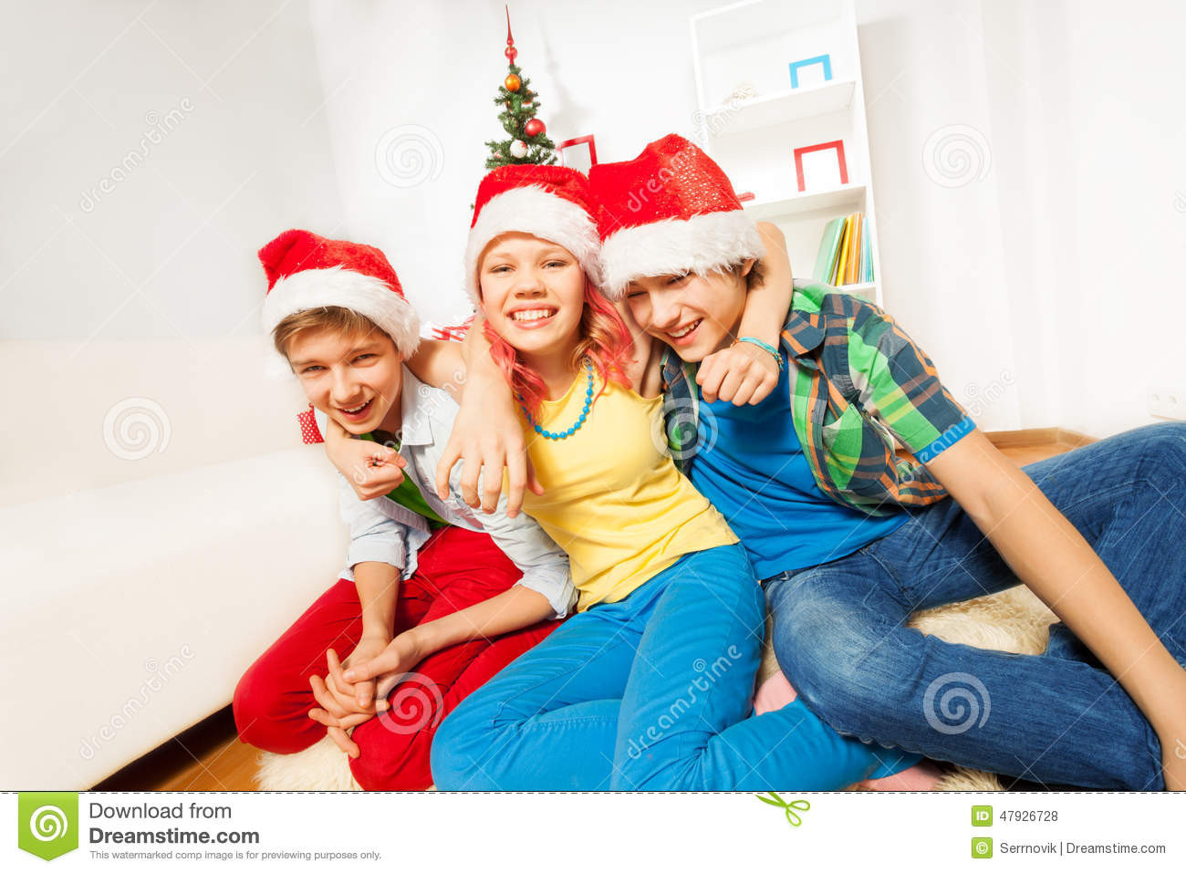 Teenage Christmas Party Ideas
 Teens Kids Christmas Party In Santa Hats Stock