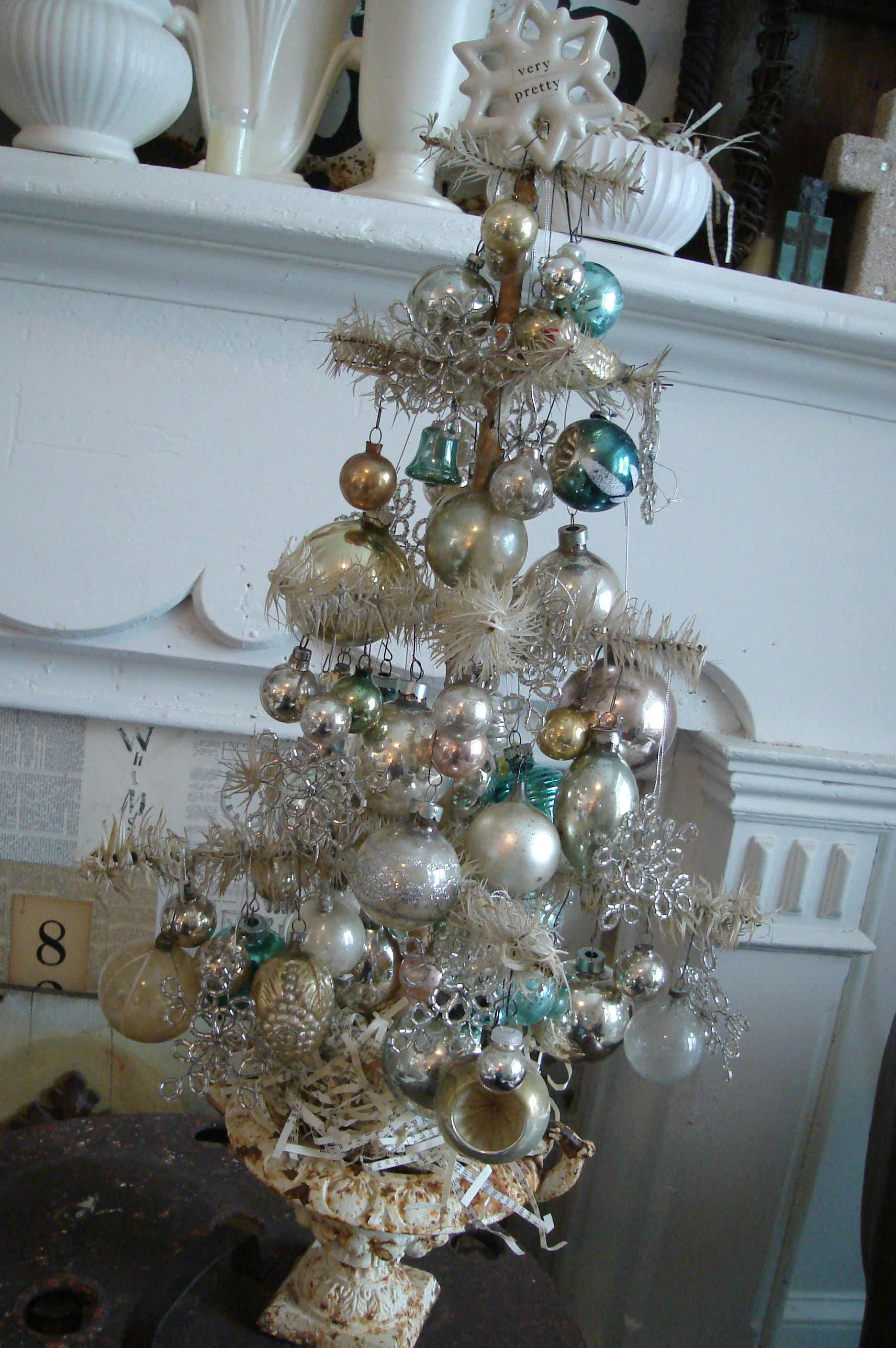 The Rooftop Christmas Tree Cast
 Table top Christmas tree in cast iron planter in silver